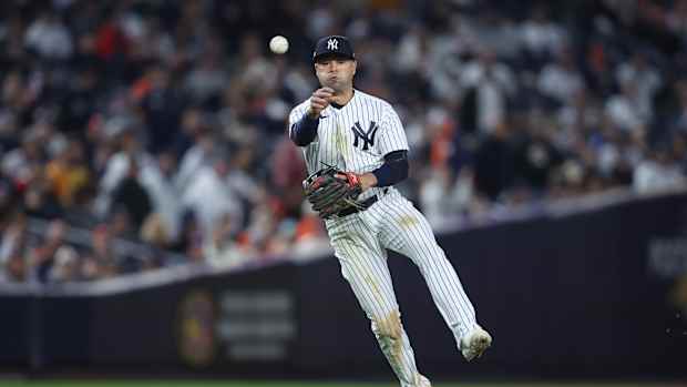 New York Yankees SS Isiah Kiner-Falefa throws to first base